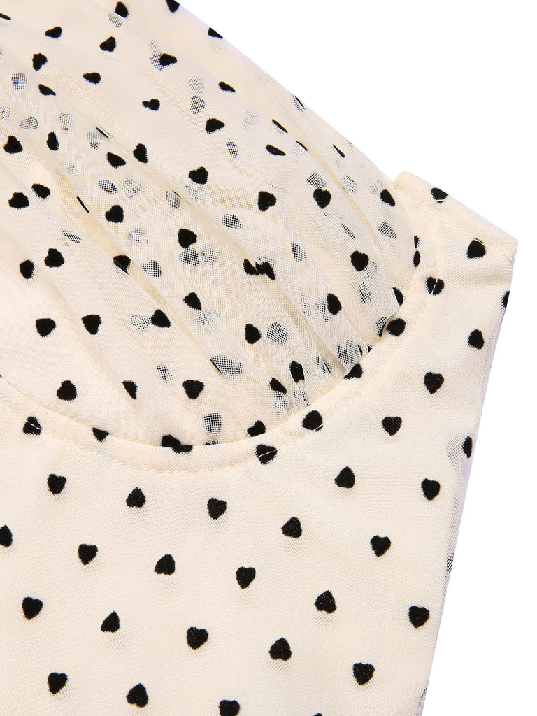 Combinaison dos nu beige et noire à pois coeur des années 1950