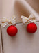 Boucles d'oreilles diamant nœud de Noël rouge