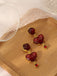 Boucles d’oreilles vintage en résine coeur bordeaux
