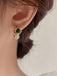 Boucles d'oreilles strass avec pierres précieuses vertes
