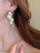 Boucles d'oreilles en plastique à pampilles et perles beiges