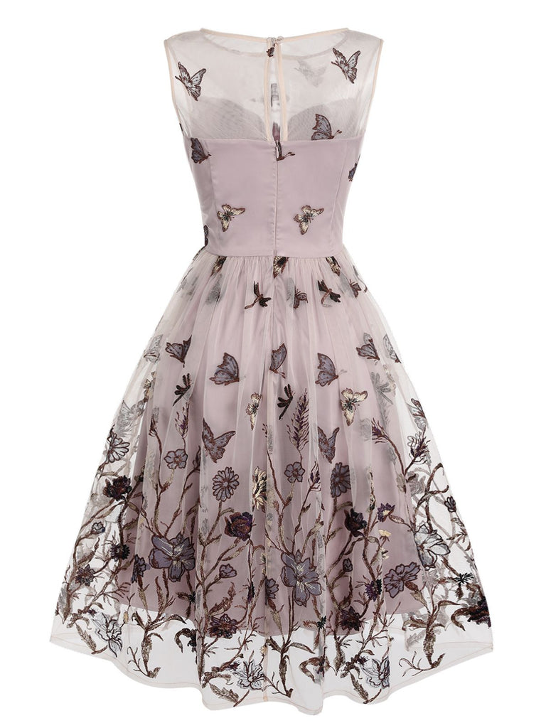 Robe trapèze violette en dentelle papillon années 1950