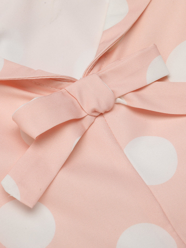 Robe rose pêche à pois années 1940 à manches courtes