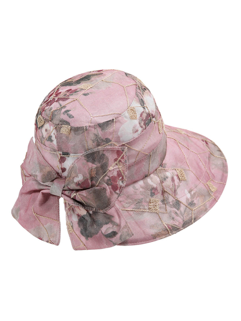 Chapeau de soleil à larges bords floraux et nœud papillon